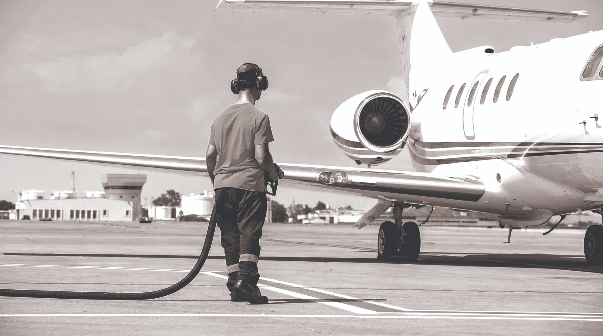 Line technician refueling a business jet on the ramp